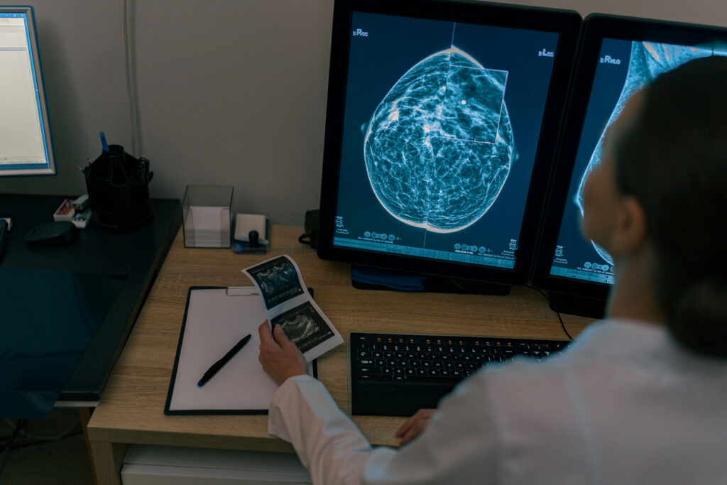 Female doctor neuroscientist analyzing scan MRI images in hospital. High quality photo