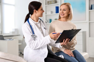 Woman having appointment with doctor in hospital