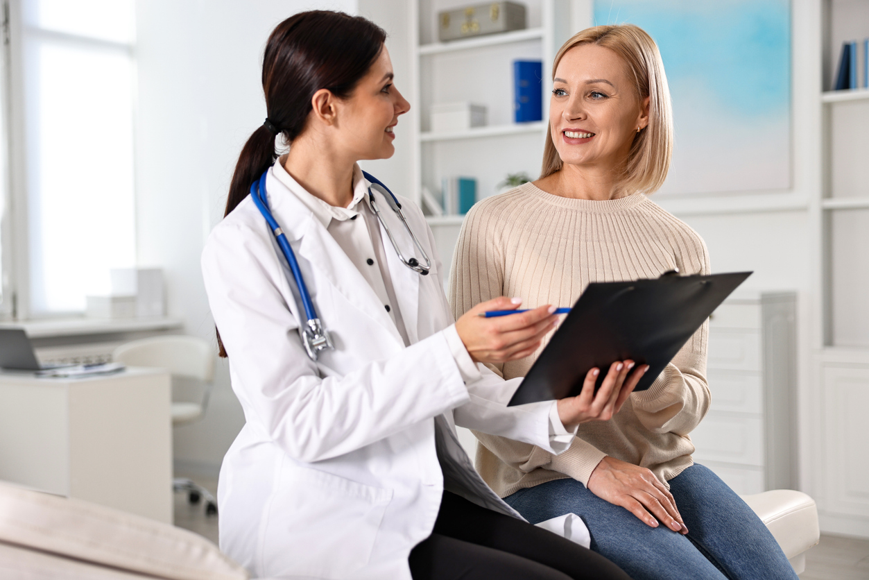 Woman having appointment with doctor in hospital