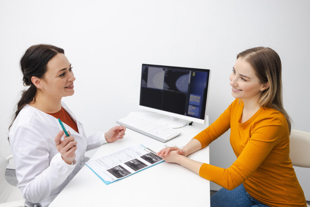 Treatment of fibroadenoma of mammary gland and cancer. Doctor's consultation for woman patient with breast disease